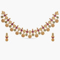 A picture of Indian artificial jewelry. It is a traditional necklace set with red and green gemstones, featuring Cubic Zirconia.